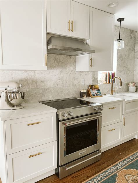 stainless steel appliances with gold cabinet hardware|kitchen appliances with gold handles.